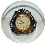 New Haven novelty clock, small in a 6 inch round beveled glass. — Antique Clocks Price Guide