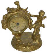 Golden Novelty Co. small clock with cupid, excellent finish on the 5.5 inch case. — Antique Clocks Price Guide