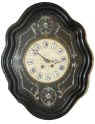 French picture frame clock, in a typical case, wood with plaster over the frame then painted black. — Antique Clocks Price Guide