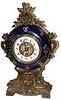 French dark blue porcelain bowl holding an 8 day timepiece inside.