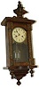 Miniature German wall clock, 24 inches high, espousing a lot of attractive wood work.