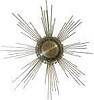 "Made In Germany, 8 day" time only, in an art deco Sunburst design.