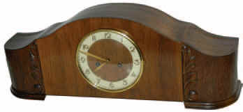 Gustav Becker Art Deco Tambour in a very large case, 25.5" wide, 9 inches tall. Made of light walnut veneer. — Antique Clocks Price Guide