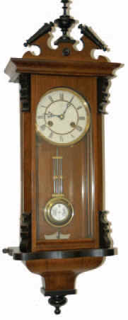 Junghans small spring Vienna (RA). The walnut finished case has the original ebony trim and is 32 inches tall. — Antique Clocks Price Guide