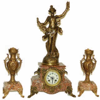 French three piece clock set retaining all its applied pieces which are original and exceptionally clean. All the metal has been refinished professionally, and the clock is ready to adorn your living room mantle. — Antique Clocks Price Guide