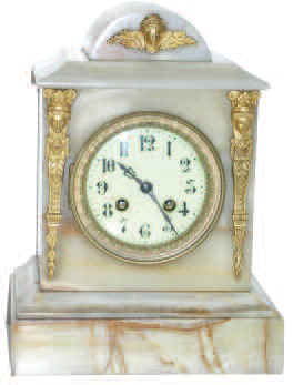 French shelf clock, ca 1890. 11.5 inches tall white onyx case with applied brass Egyptian figures. — Antique Clocks Price Guide
