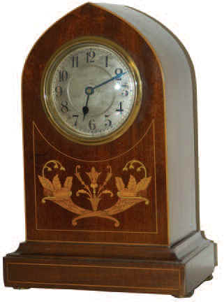 French beehive with excellent wood inlay of "horns of plenty" and string inlay around all the front edges. The 12 inches high mahogany veneered case is near perfect on front and sides. — Antique Clocks Price Guide