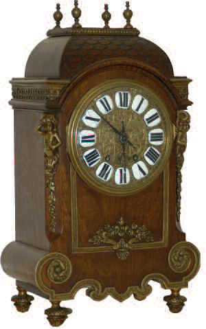 French dome top bracket clock, with an unusual fish scale roof, almost a "Widows Walk" on the flat top, and an abundance of attractive brass trim. — Antique Clocks Price Guide