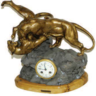 French statue clock featuring two big cats in mortal combat. — Antique Clocks Price Guide