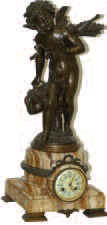 French "Doctor Love" statue, on a marble clock base. Doctor Love is a Cupid-Angel, carrying a doctors bag in his hand and has bow and arrows on his back. — Antique Clocks Price Guide