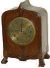 French mantle clock cased just a bit different, ca about 1900. — Antique Clocks Price Guide