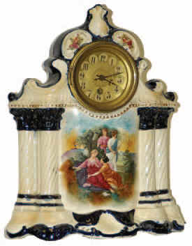 English porcelain clock stamped "Made in England" and some other things I can't read. Some cobalt blue was used, a lot of cream, the flower paintings, and the 4 lookers on the front. — Antique Clocks Price Guide