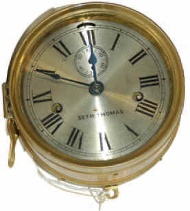 Seth Thomas ships clock, "Eight Day Lever", ca 1936. Brass case flanged front and back, hinged bezel, 5.25 inches silverplated dial. — Antique Clocks Price Guide