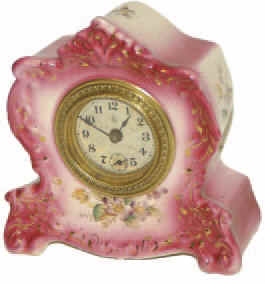 William L. Gilbert Clock Co., Winsted, Conn. Patented Jan 25, '88; Pat. Mar 13, 1900", all stamped on the rear movement cover. Also, the name "Myrtle" on the back. Ca 1904, give or take. — Antique Clocks Price Guide