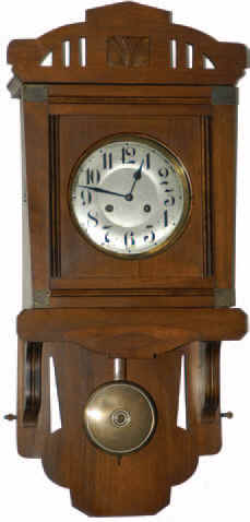 Junghans wall regulator, ca 1900. This is a "Free Swinger", running 8 days and striking a large coil gong half hours and hours. — Antique Clocks Price Guide
