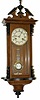 Junghans small spring Vienna (RA). The walnut finished case has the original ebony trim and is 32 inches tall.