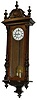 German Vienna Regulator, 2 weights, in a walnut veneered case, 51 inches tall. The door has turned, fluted, and carved half columns.