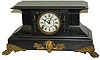 E. Ingraham Clock Co. "Magnolia", ca 1891, an enameled wood cased black.