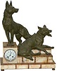 French statue clock featuring two German shepherd dogs on top of a marble based clock.