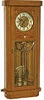 Gustav Becker two weight movement, ca 1886, serial number No. 599900, now in a ca1920 golden oak case with 8 panes of heavily beveled glass in a brass frame.