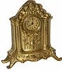 American novelty clock, slightly under 9 inches tall, 2 cupids reclining above the dial. All original, running, has all its knobs and screws in place.