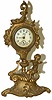 Jennings Bros. metal novelty clock that stands 9.5 inches high.