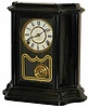 E. Ingraham enameled wood case clock, 13.25 inches high and called the "Black Prince", ca 1881.