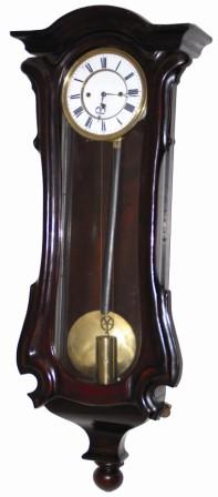 German three quarter sized Vienna regulator. Unusual in that it has only one weight that runs the time portion of the movement and it has two springs that powers the hour strike and quarter hour strike. — Antique Clocks Price Guide