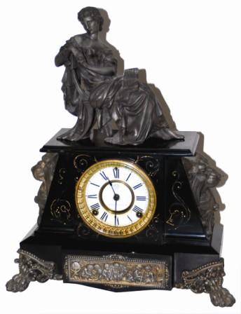 Ansonia Clock Company, enameled iron case mantle clock, "Nubia", ca 1894. The clock without the seated statue is 17" wide and 11" high. — Antique Clocks Price Guide