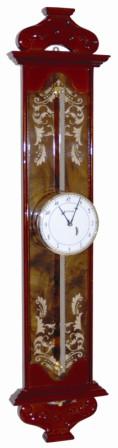 Copy of an early German Saw Clock. It is 30" high, 7" wide, has a slick walnut finish with nice carvings and gilded Victorian designs. — Antique Clocks Price Guide