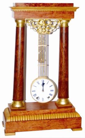 Mystery swinger has an upside down pinwheel escapement movement. It is time and strike, has a porcelain dial with subsidiary seconds dial and hand. — Antique Clocks Price Guide