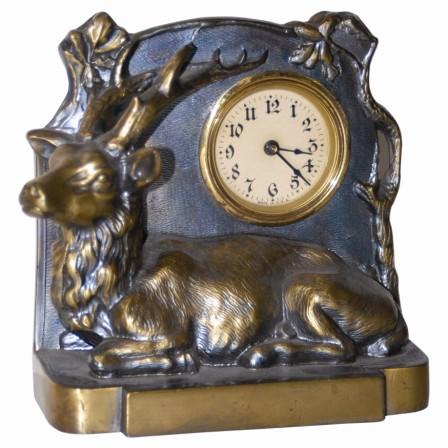 American novelty featuring an elk. Cast metal case is 6" high, has the excellent original finish. — Antique Clocks Price Guide