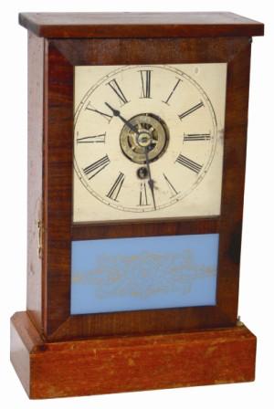 Wm. L. Gilbert "Cottage No. 2", ca 1860. Pine case is 11.5" high, mahogany veneered on the door. — Antique Clocks Price Guide