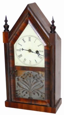 Early miniature steeple, reportedly made by Chauncey Jerome. Everything about the clock points to it being American made, but I have never seen an American miniature steeple, or miniature anything else with an old print inside the clock. — Antique Clocks Price Guide