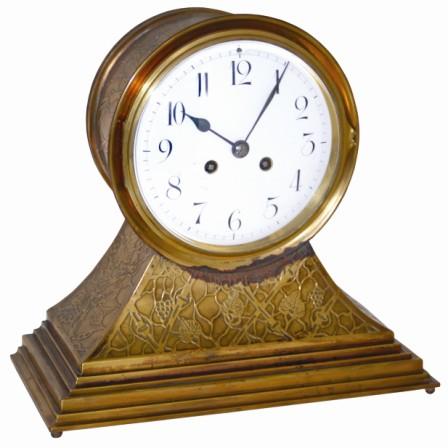French brass/bronze, tambour style clock, ca 1885. Cast designs of leaves, grapes, and vines over the entire case. — Antique Clocks Price Guide