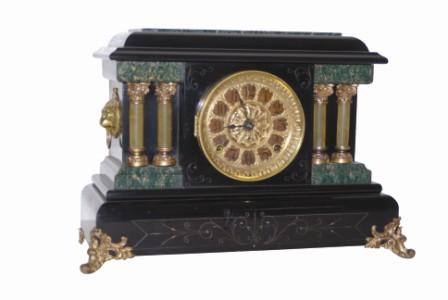 Seth Thomas Clock Co. adamantine finished case is black with green marbleized moldings around each end and the top layer of adamantine is green. — Antique Clocks Price Guide