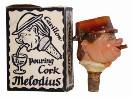 Black Forest musical novelty, a carved "Bottle Head". This one is different from most we have sold. — Antique Clocks Price Guide