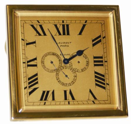 Swiss desk clock with three calendar dials showing months, days, and day of the month. It is a beautiful clock, gold/brass colored frame and dial, beveled glass, five original blued hands, and is signed on the dial, "Laurent / Paris / 8 Jours", and on the case, "Depose / 427". — Antique Clocks Price Guide