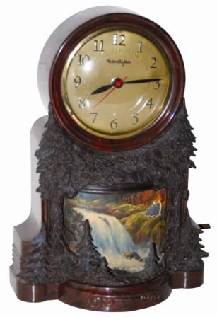 Mastercrafter "Waterfall". Very nice 11" high case, rustic wooded motif on front. — Antique Clocks Price Guide