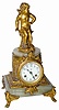 Jennings Bros marble statue clock with bronze/brass cupid on top. The metal ornaments and case body other than the marble, is brass.