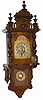 Gustav Becker open well type wall regulator, ca around 1900. It has a spring driven 8 day movement, seat board mounted, and striking a large iron coil gong mounted to the case back.