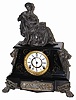 Ansonia Clock Company, enameled iron case mantle clock, "Nubia", ca 1894. The clock without the seated statue is 17" wide and 11" high.