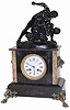 French marble clock with statue on top. It would appear the wrestler on top has a pretty tight hold on the other fellows arm.