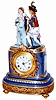 Porcelain figural mantle clock, 18" high, with boy and girl figures. The china case has painted sections, the gold matching the brass sections around the case and around the bezel.