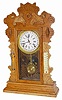 Waterbury Clock Co. oak calendar clock, shelf model, "Gibson", c 1912.