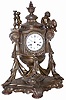 Large French metal clock, adorned with cupids and many other cast ornaments, with an early silk thread suspension movement, ca around 1850. The case is 21" tall and very heavy.