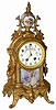 Wm. L. Gilbert Clock Co. fancy metal and china mantle clock, "Gabriel", ca 1904.