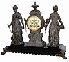 Ansonia Clock Company's large figure clock, a double statue, "Art And Commerce", ca 1894. The base is black enamel on iron with gold incised designs.