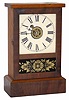 Waterbury Clock Company mantle clock, "Cottage", ca 1861. Case is only 11" high, appears to have some mahogany and some pine woods.