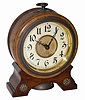 German alarm clock in a wood case. Brass ornaments top and base, flat glass in the sash, very good dial and hands, bell underneath.